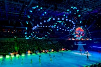 an ice rink with people on the ice